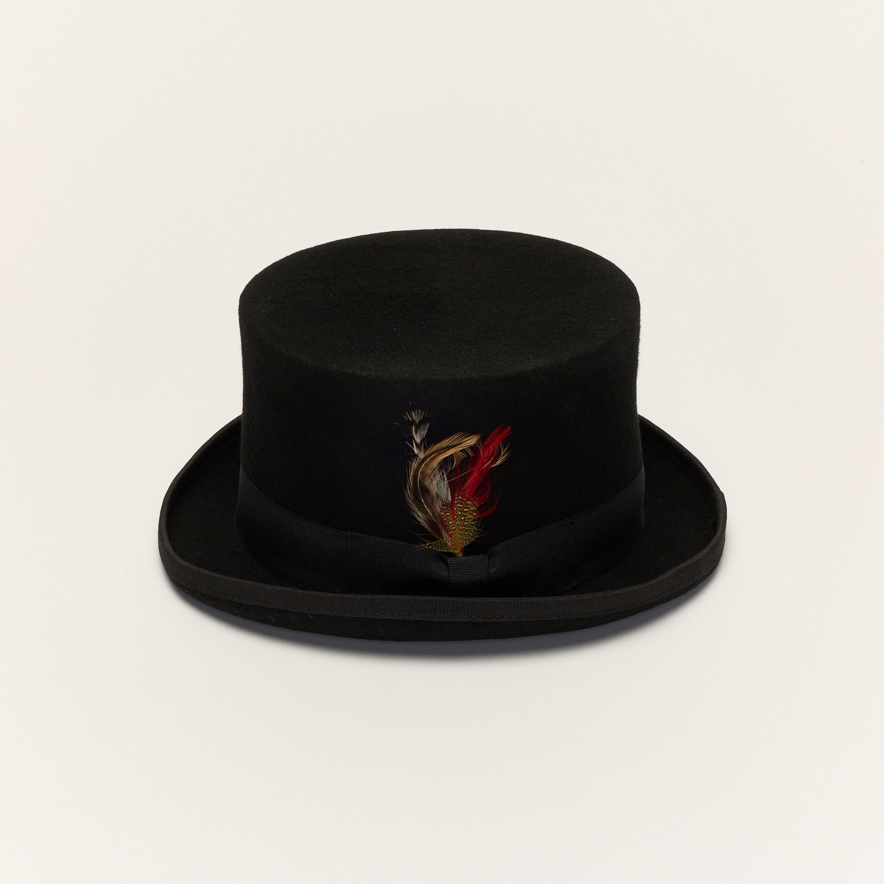 Carriston black wool felt top hat front view with grosgrain ribbon and feather