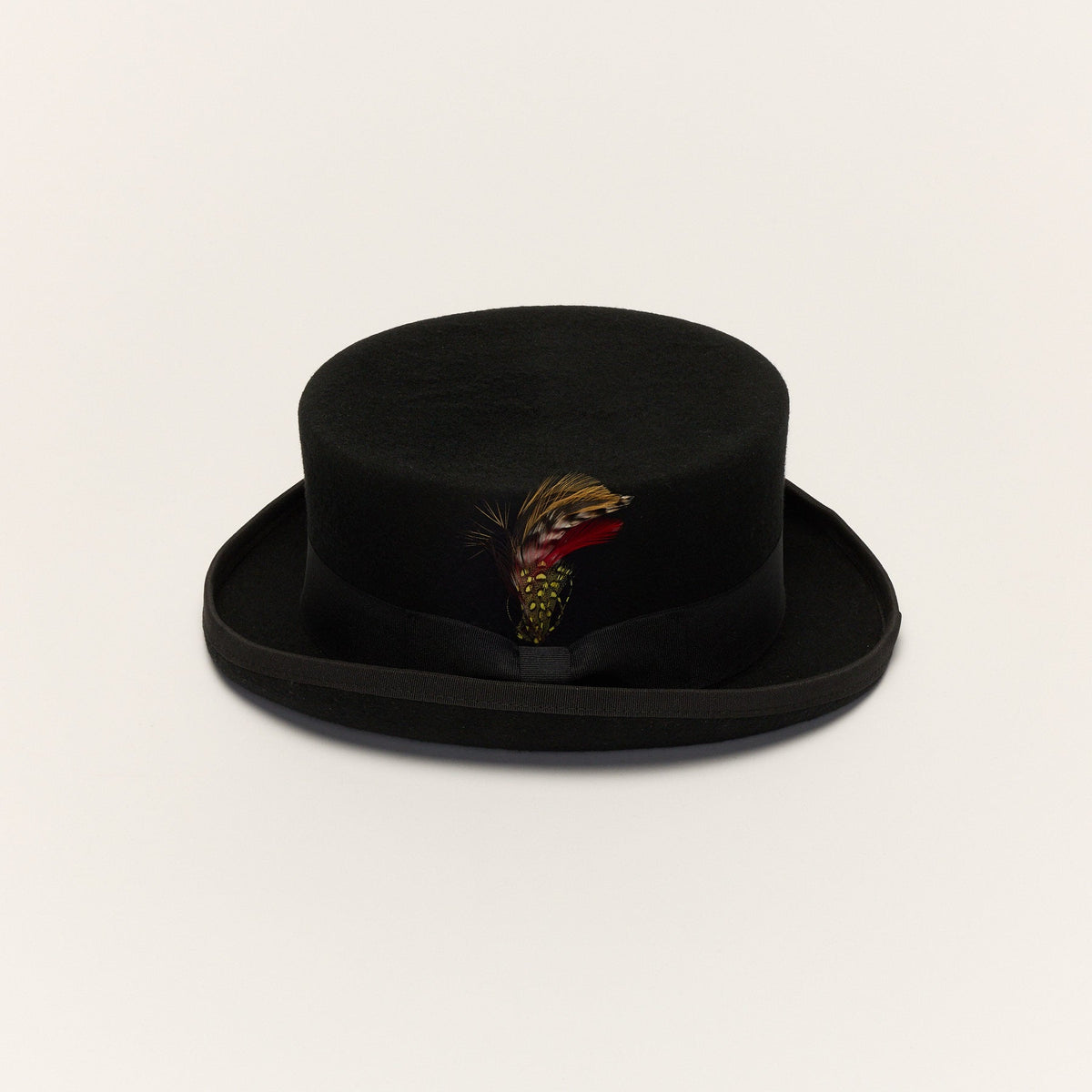 Black short crown top hat front view with removable feather and grosgrain ribbon